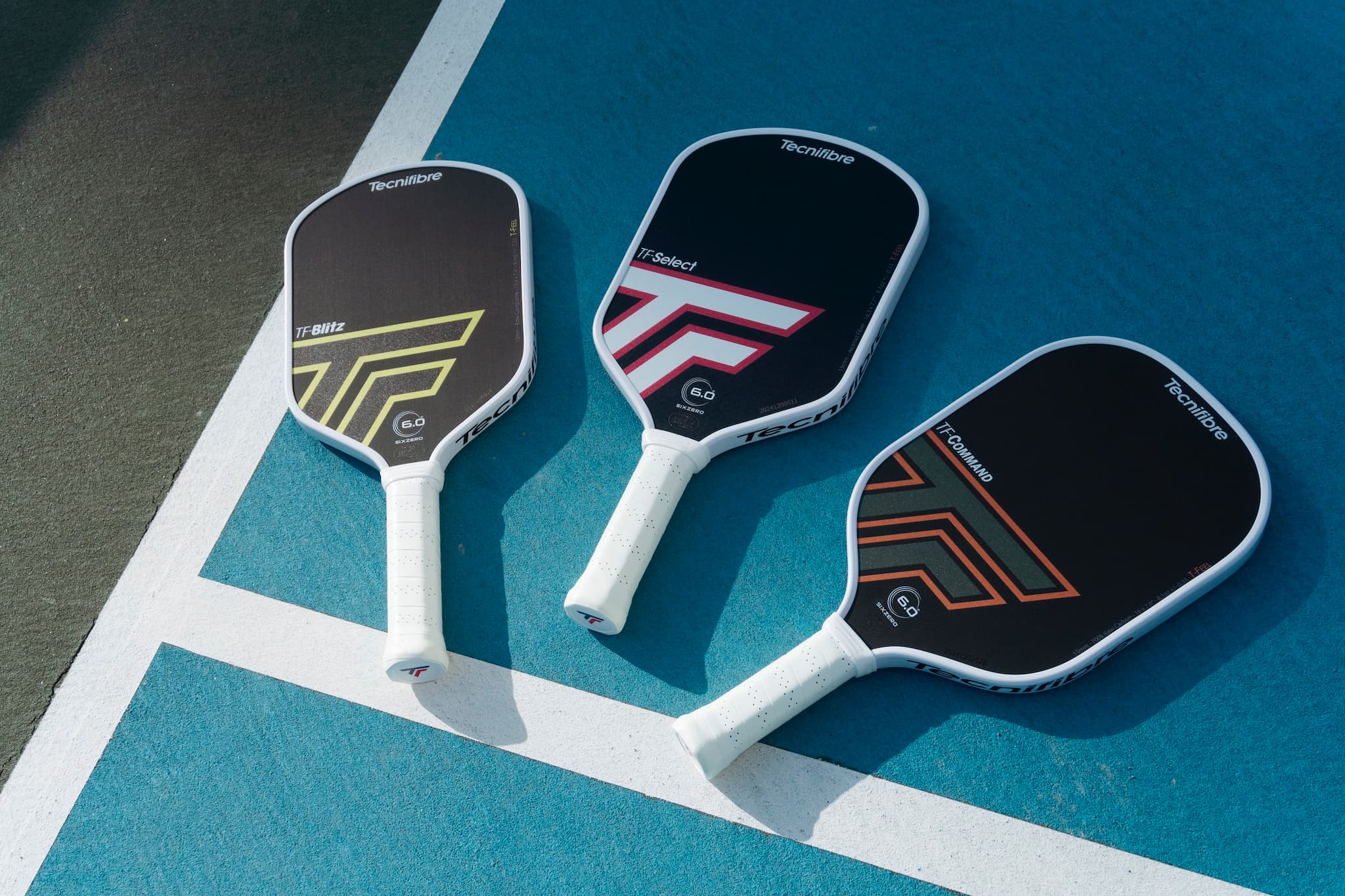Tecnifibre pickleball paddles on a court