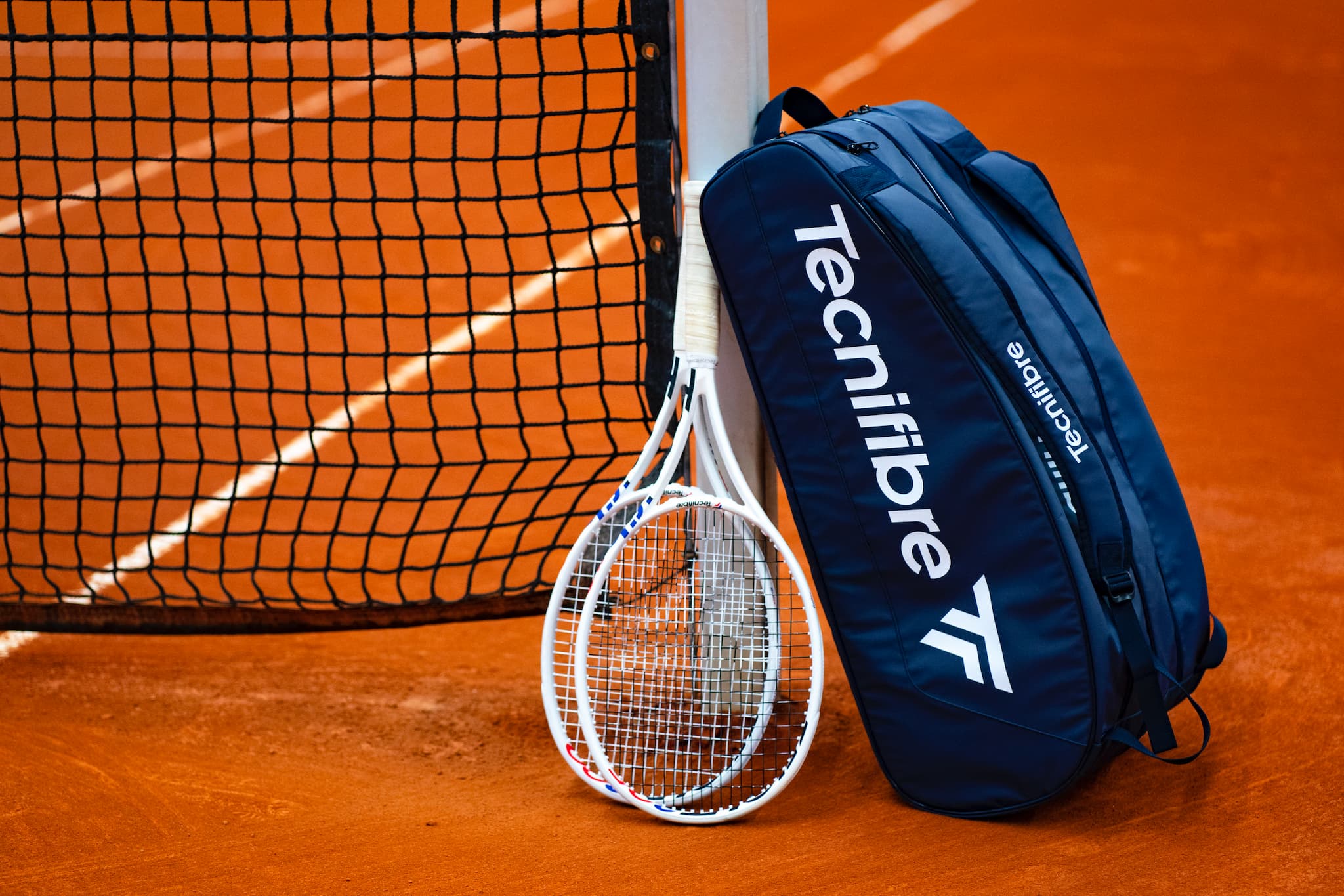 Tecnifibre blue bag on clay court