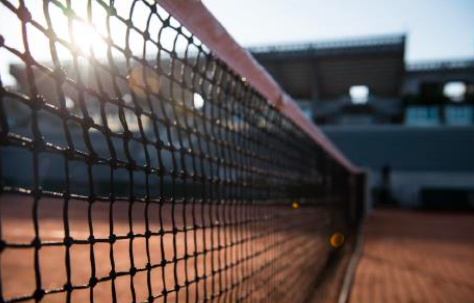 Tennis net on clay court